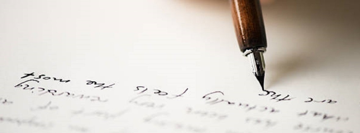 Hand writing with a plume and ink